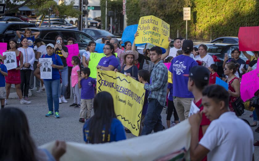 PASADENA, CALIF. -- THURSDAY, OCTOBER 24, 2019: Protestors rally outside the Pasadena Unified School Board meeting after marching from Pasadena City Hall. The Pasadena Unified School Board was voting Thursday on whether to close some middle and/or high schools because of declining enrollment. The group protested outside the meeting. Photo taken in Pasadena, Calif., on Oct. 24, 2019. (Allen J. Schaben / Los Angeles Times)