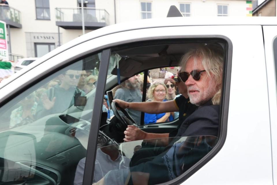 Bob Geldof rides in a taxi as part of the funeral cortege (Liam McBurney/PA Wire)