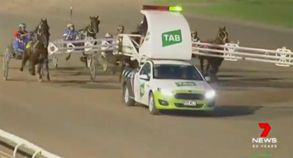 The boom gates of the mobile pace car are supposed to close to allow the horses to pass. Source: 7 News