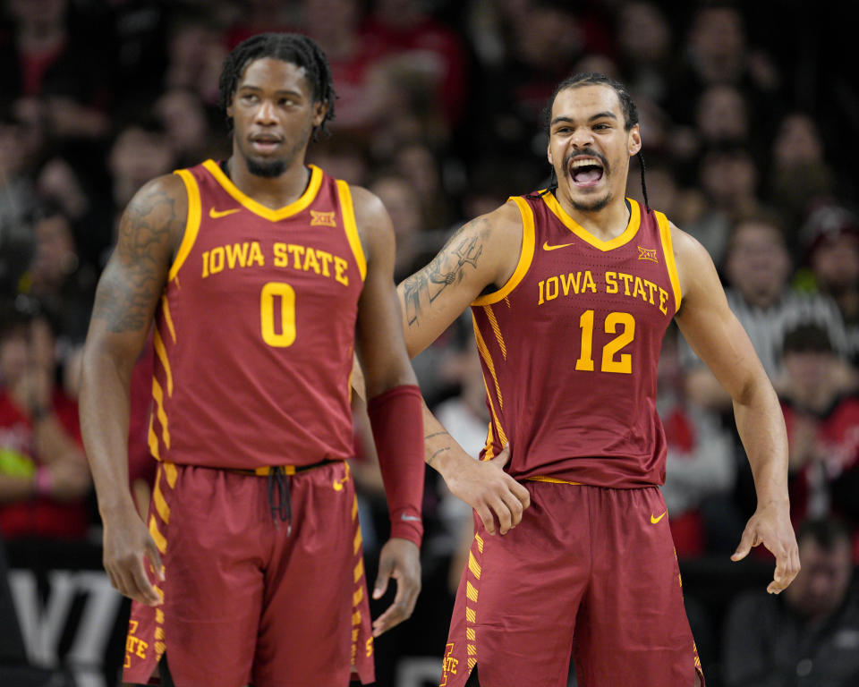 Iowa State's Robert Jones (12) shouts as Tre King (0) looks on during the second half of an NCAA college basketball game against Cincinnati, Tuesday, Feb. 13, 2024, in Cincinnati. (AP Photo/Jeff Dean)