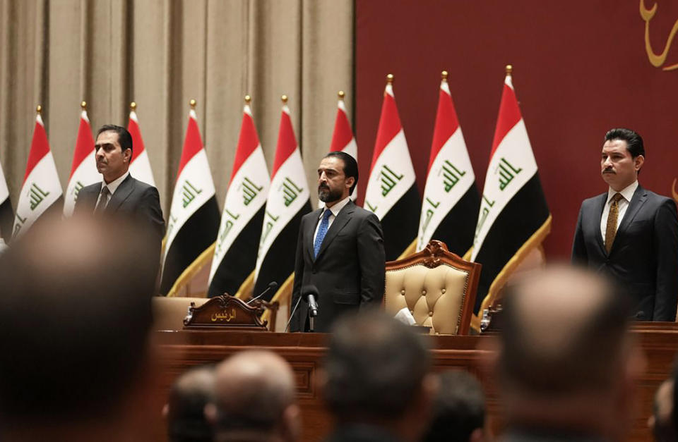This photo provided by Iraqi Parliament Media Office, shows Iraqi lawmakers attending a parliamentary session with the new government in Baghdad, Iraq, Thursday, Oct.27, 2022. (Iraqi Parliament Media Office via AP)