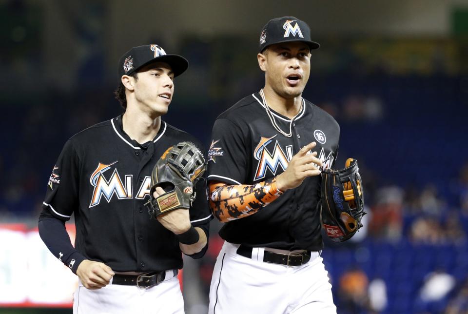 Christian Yelich and Giancarlo Stanton are turning the Marlins into a watchable team. (AP Photo/Wilfredo Lee)