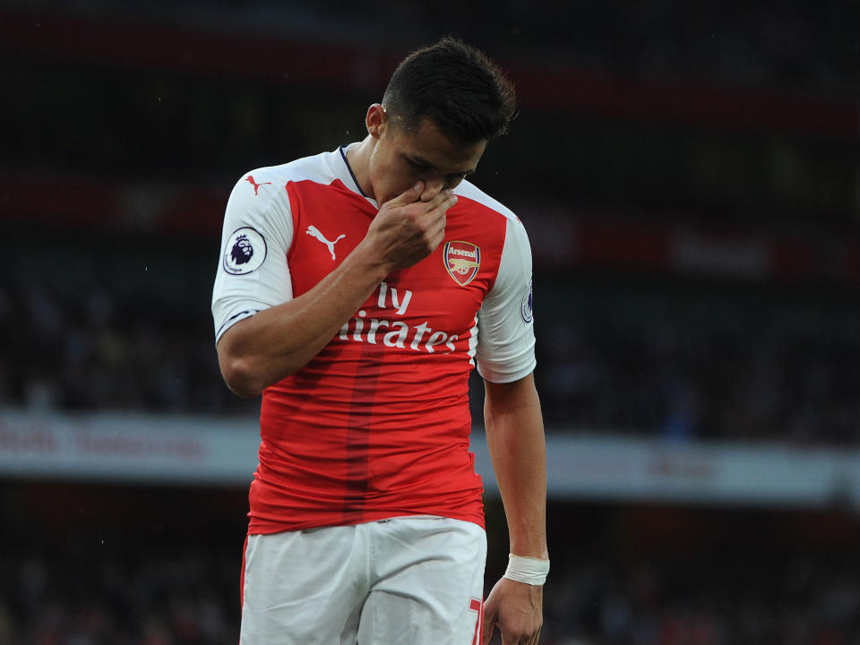 Alexis Sanchez has mounted a defence of his beleaguered manager Arsene Wenger: Getty