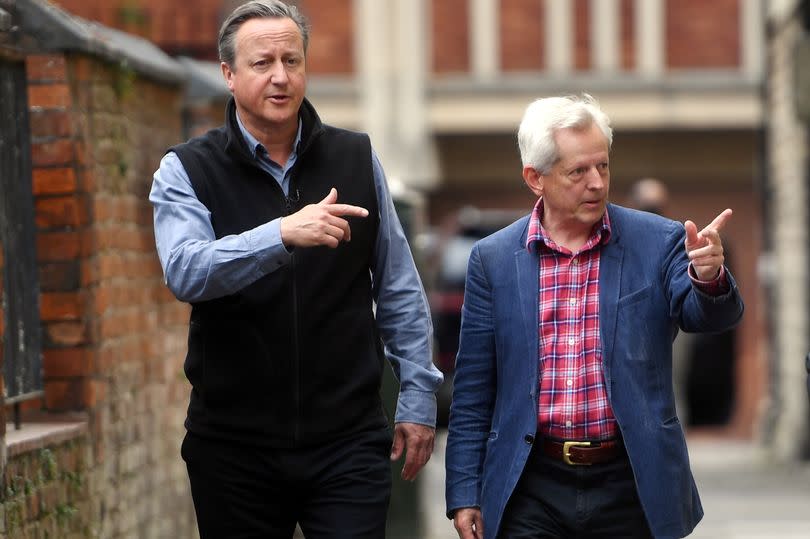 Lord David Cameron, Former Prime Minister and Secretary of State for Foreign, Commonwealth and Development Affairs, with Gloucester Conservative Candidate Richard Graham during a visit to Gloucester City Centre in Gloucestershire on July 1, 2024