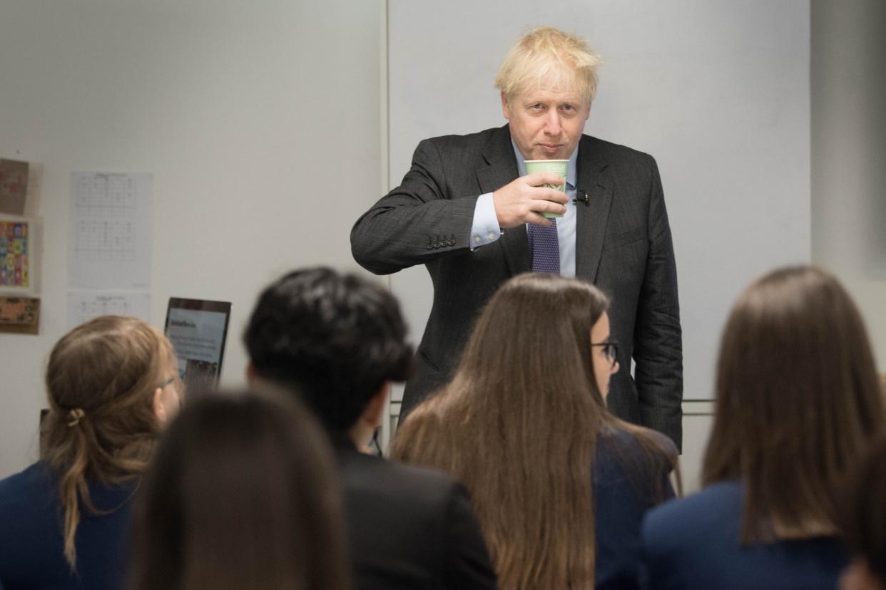 Prime Minister Boris Johnson meets pupils and takes part in a  media studies class during a visit to Ruislip High School in his constituency of Uxbridge, west London in September (Stefan Rousseau/PA Wire)