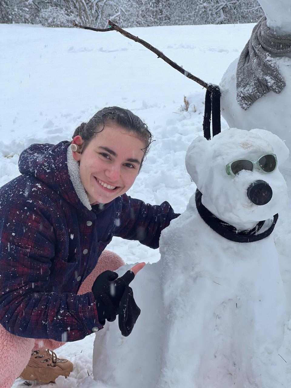 Maure Thompson made a snowdog with her family this winter. At the orphanage, she told Colleen Thompson she wanted to be adopted by a family with lots of pets. The Thompsons have three dogs.