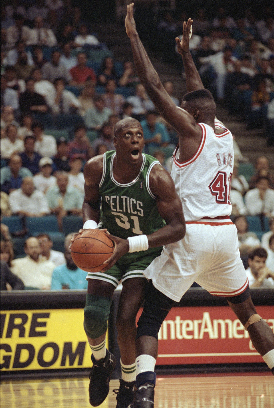 Xavier McDaniel (31) forward for the Boston Celtics, slips by Glen Rice (41) guard for the <a class="link " href="https://sports.yahoo.com/nba/teams/miami/" data-i13n="sec:content-canvas;subsec:anchor_text;elm:context_link" data-ylk="slk:Miami Heat;sec:content-canvas;subsec:anchor_text;elm:context_link;itc:0">Miami Heat</a>, as he sets up for a shot during the first half of their game at the Miami Arena in Miami. Fla., Nov. 10, 1992. AP Photo/Kathy Willens