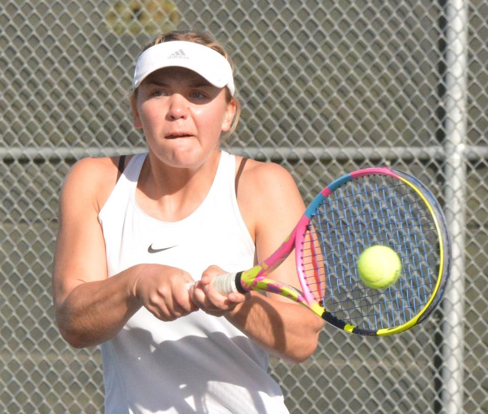 Aberdeen Central's Reese Comstock smacks a return during her third flight semifinal singles match in the Eastern South Dakota Conference girls tennis tournament on Tuesday, Oct. 1, 2024, at the Highland Park Courts in Watertown.