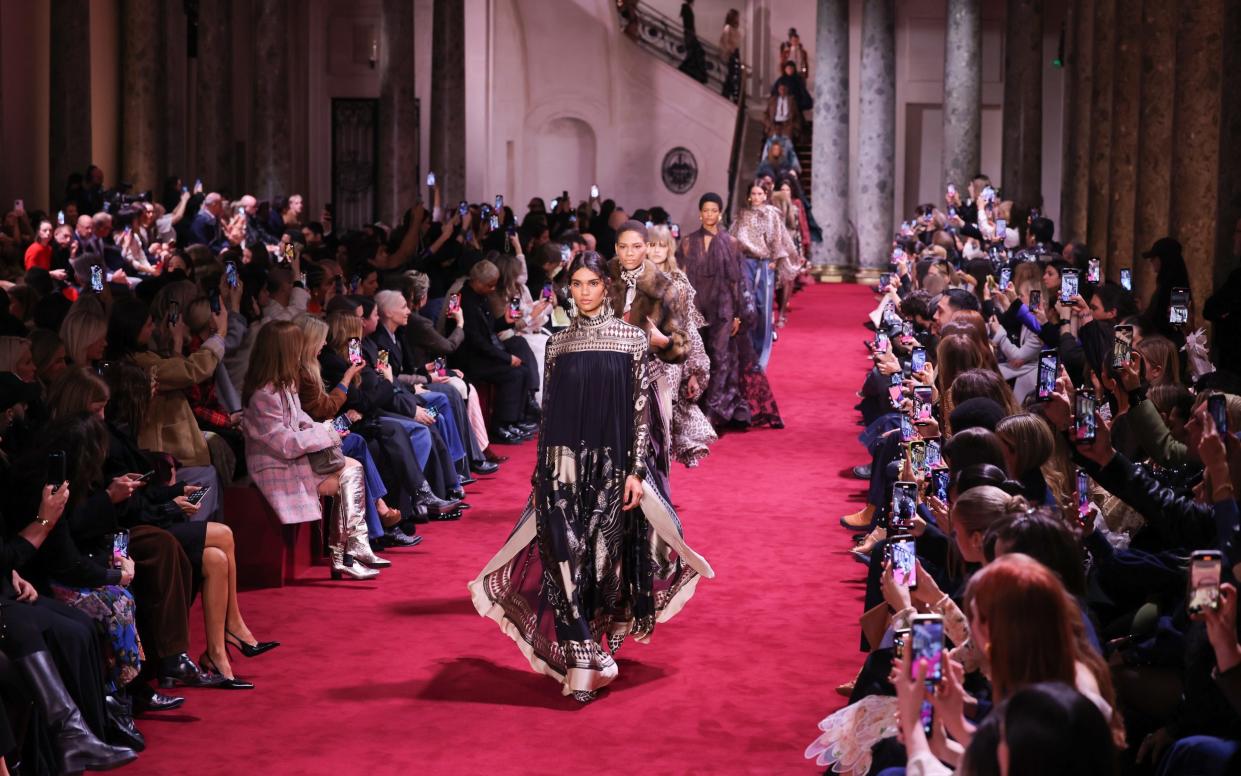 Guests capture the finale of the Zimmermann show during Paris Fashion Week 2024