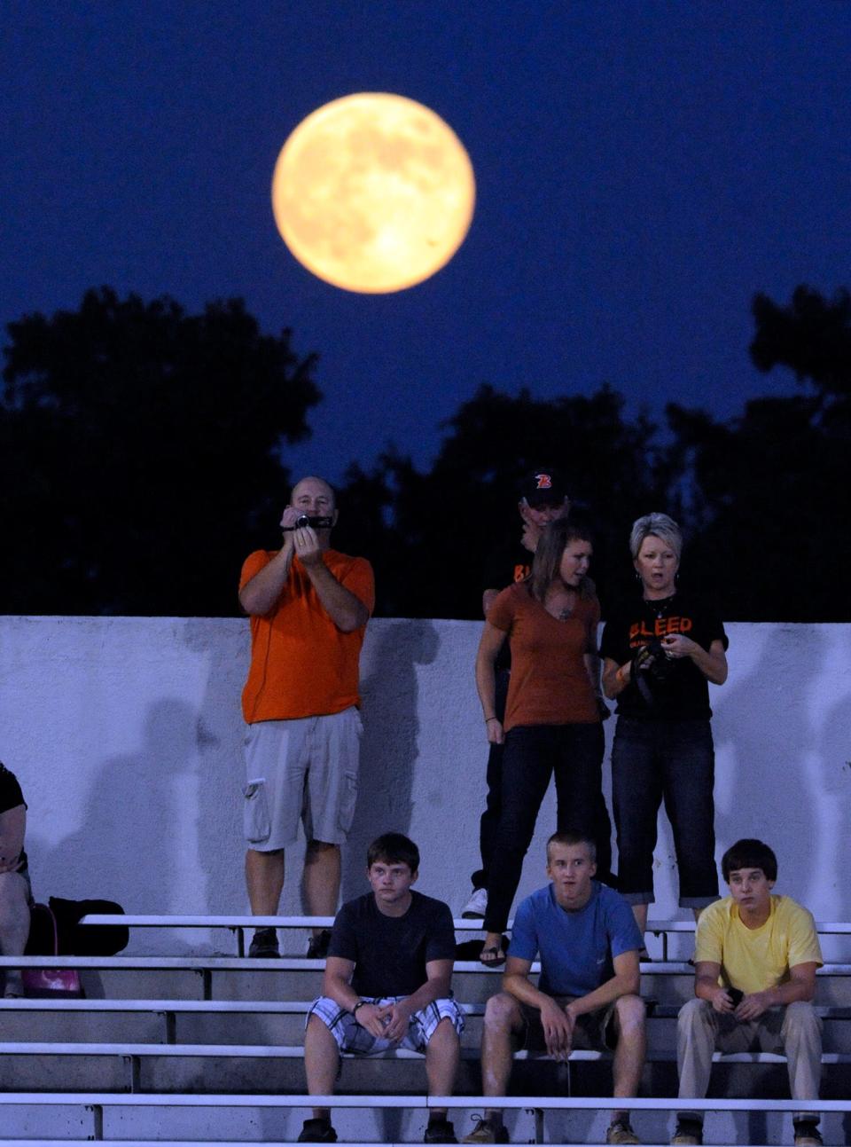 In this file photo, August's Blue Moon rises over Wallace-Rose Hill fans at Legion Stadium in Wilmington as their football team faced New Hanover High School.