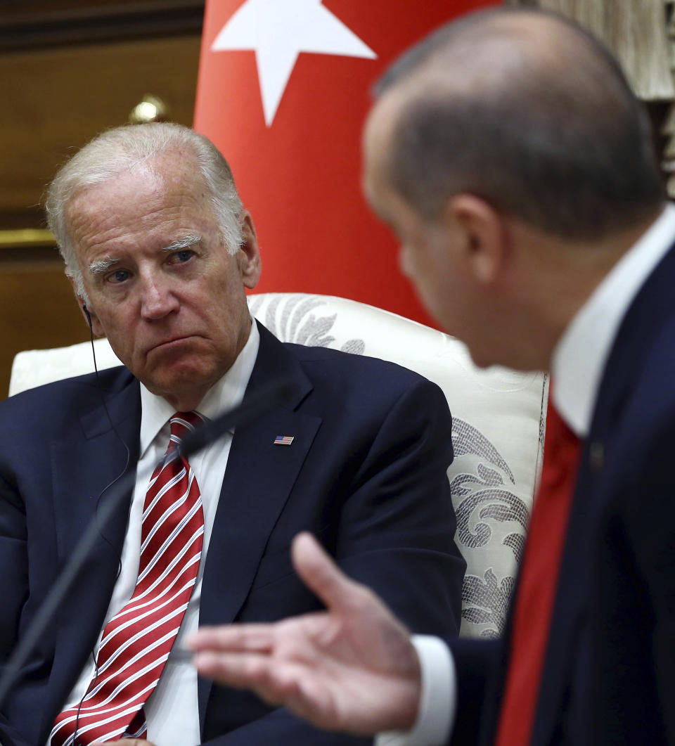 FILE- In this Wednesday, Aug. 24, 2016 file photo, then U. S. Vice President Joe Biden, left, listens to Turkish President Recep Tayyip Erdogan during a meeting in Ankara, Turkey. Erdogan has toned down his anti-Western and anti-US rhetoric in an apparent effort to reset the rocky relationship with his NATO allies. So far, however, he’s been met by silence from U.S. President Joe Biden. Nearly two months into his presidency, Biden still hasn’t called Erdogan, which some in Turkey see as a worrying sign. (Kayhan Ozer, Presidential Press Service Pool via AP, File)