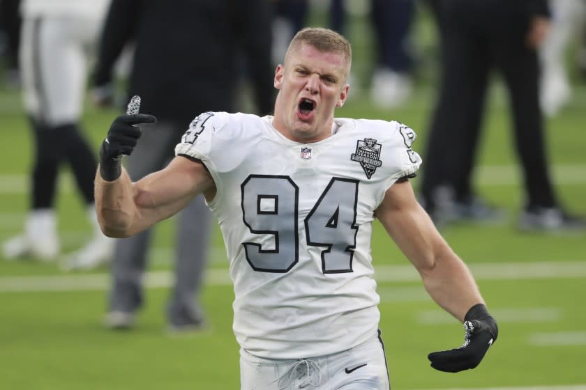 Las Vegas Raiders defensive end Carl Nassib (94) celebrates after the Las Vegas Raiders holds on to defeat the Los Angeles Chargers on the last play of the game during an NFL football game, Sunday, November 8, 2020, in Inglewood, Calif. (AP Photo/Peter Joneleit)
