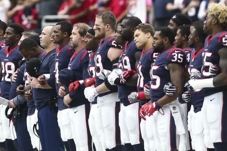 Oct 1, 2017; Houston, TX, USA; Houston Texans players stand on the sideline during the national anthem before a game against the Tennessee Titans at NRG Stadium. Mandatory Credit: Troy Taormina-USA TODAY Sports