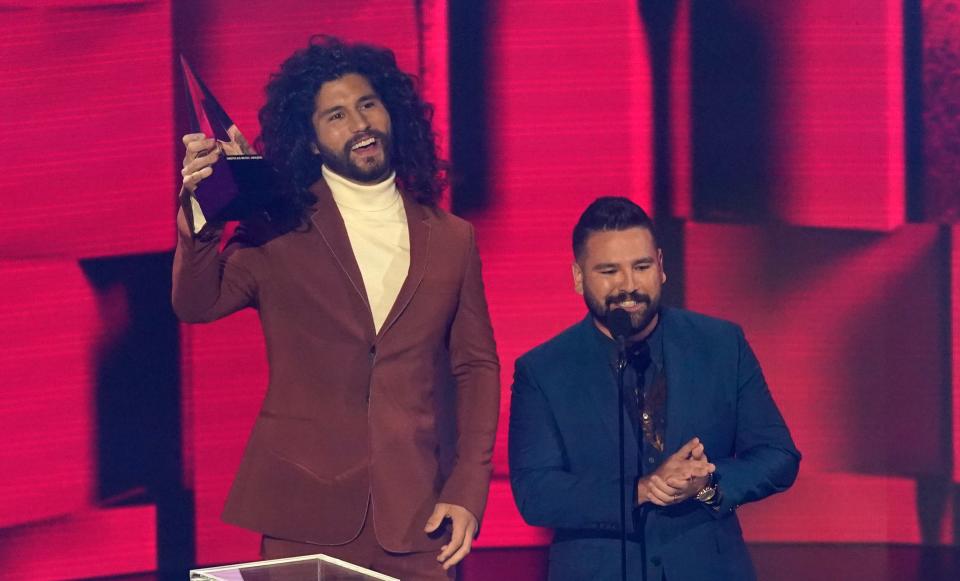 Dan Smyers, left, and Shay Mooney of Dan + Shay accept the award for favorite country song for "10,000 Hours."