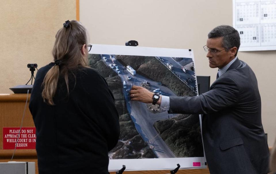 Elizabeth “Betsy” Wells (left) and San Luis Obispo County Assistant District Attorney Eric Dobroth mark an aerial view of the crime scene for the jury hearing the murder trial against Stephen Deflaun at San Luis Obispo County Superior Court on March 27, 2023.