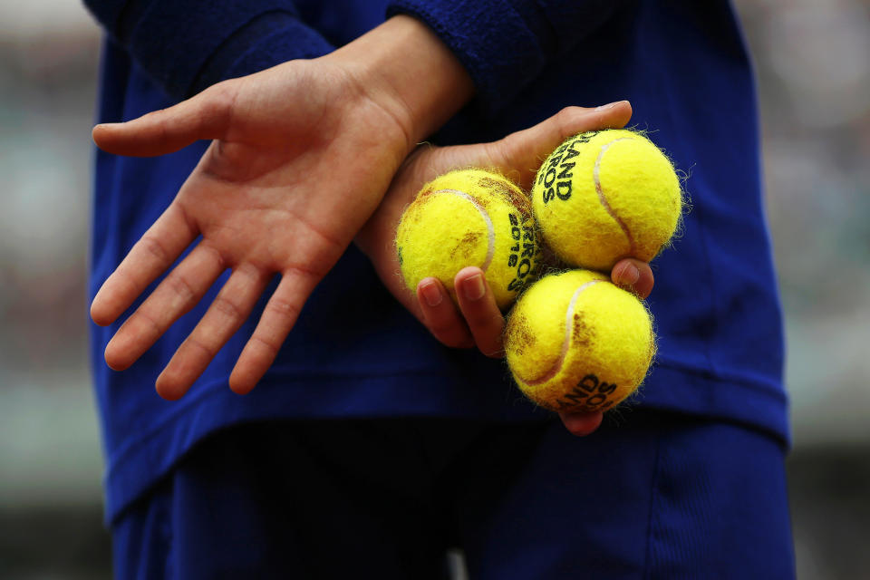 <p>A ball boy waits during the men’s singles first-round match between Yen-Hsun Lu of Taiwan and Novak Djokovic of Serbia at the French Open tennis tournament in Paris on May 24, 2016. (Yoan Valat/EPA) </p>