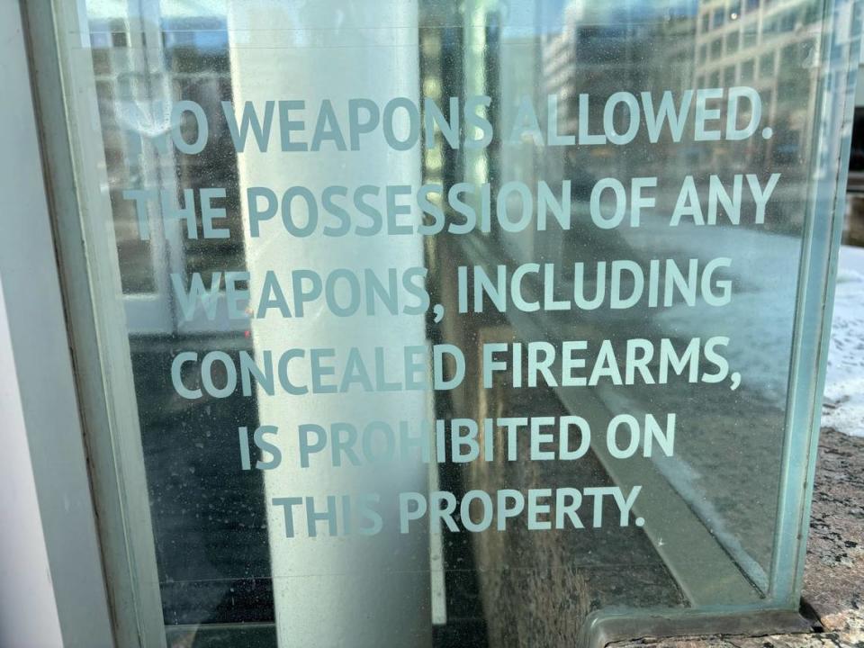 A sign prohibiting weapons, including concealed firearms, is seen on the front door of the Crown Center shopping mall on Friday, Jan. 19, 2024.
