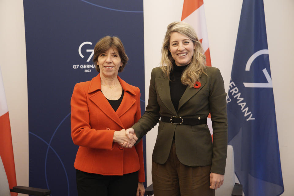 French Foreign Minister Catherine Colonna, left, and Canada's Foreign Minister Melanie Joly, right, shake hands prior to a bilateral meeting as part of a G7 Foreign Ministers Meeting at the City Hall in Muenster, Germany, Nov. 4, 2022. (Bernd Lauter/Pool Photo via AP)