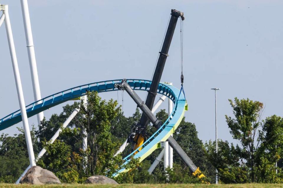 Cranes hold up the track to Fury 325 on Thursday, July 13, 2023, as the park awaits a new support column to replace a cracked one that was spotted on June 30.