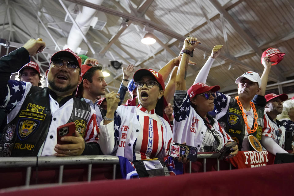 Supporters wait for former President Donald Trump at a campaign stop, Thursday, April 27, 2023, in Manchester, N.H. (AP Photo/Charles Krupa)