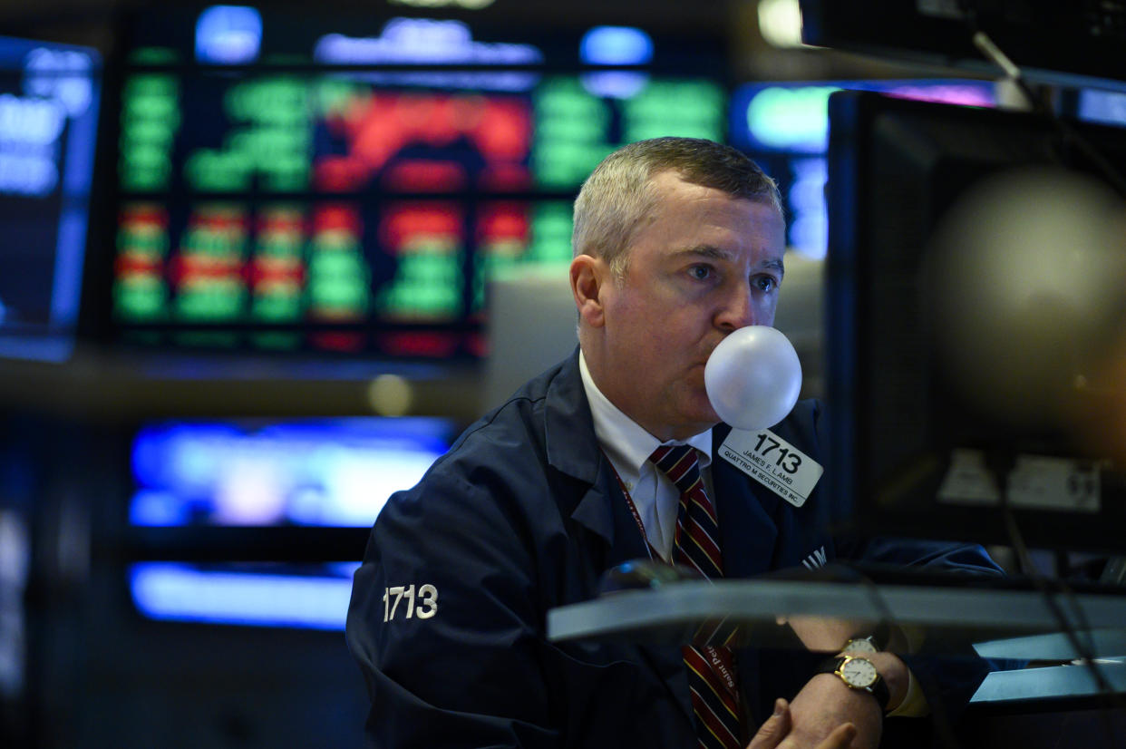 TOPSHOT - A trader makes a bubble with a chewing gum ahead of the closing bell on the floor of the New York Stock Exchange (NYSE) on January 29, 2019 in New York City. - Shares of large tech companies tumbled Tuesday ahead of big earnings announcements from the sector as US stocks finished a choppy session mostly lower. The tech-rich Nasdaq Composite Index finished 0.8 percent lower at 7,028.29. The Dow Jones Industrial climbed 0.2 percent to 24,579.96, while the broad-based S&P 500 shed 0.2 percent to 2,640.00. (Photo by Johannes EISELE / AFP)        (Photo credit should read JOHANNES EISELE/AFP via Getty Images)