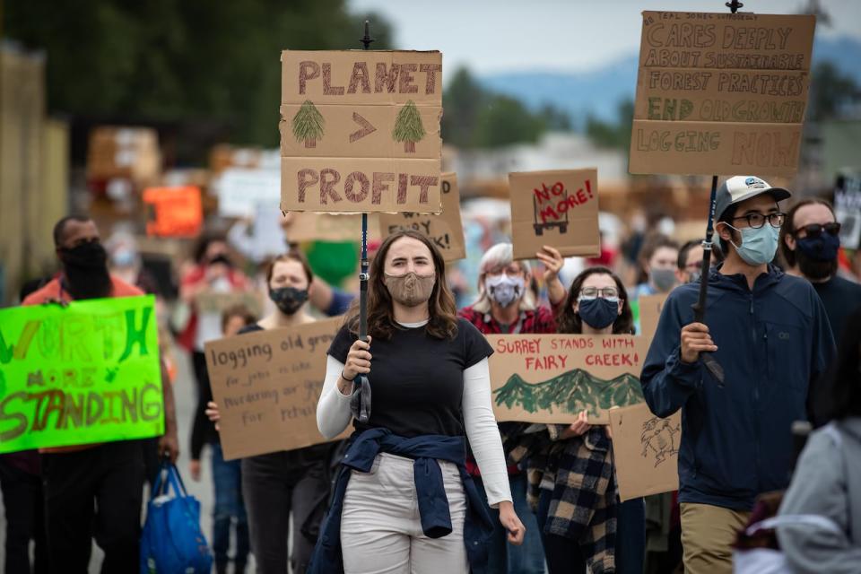 Protesters march during a demonstration against old-growth logging, at Teal-Jones Group sawmill in Surrey, B.C., on Sun. May 30, 2021. Teal-Jones holds licenses allowing it to log in the Fairy Creek Watershed on Vancouver Island.