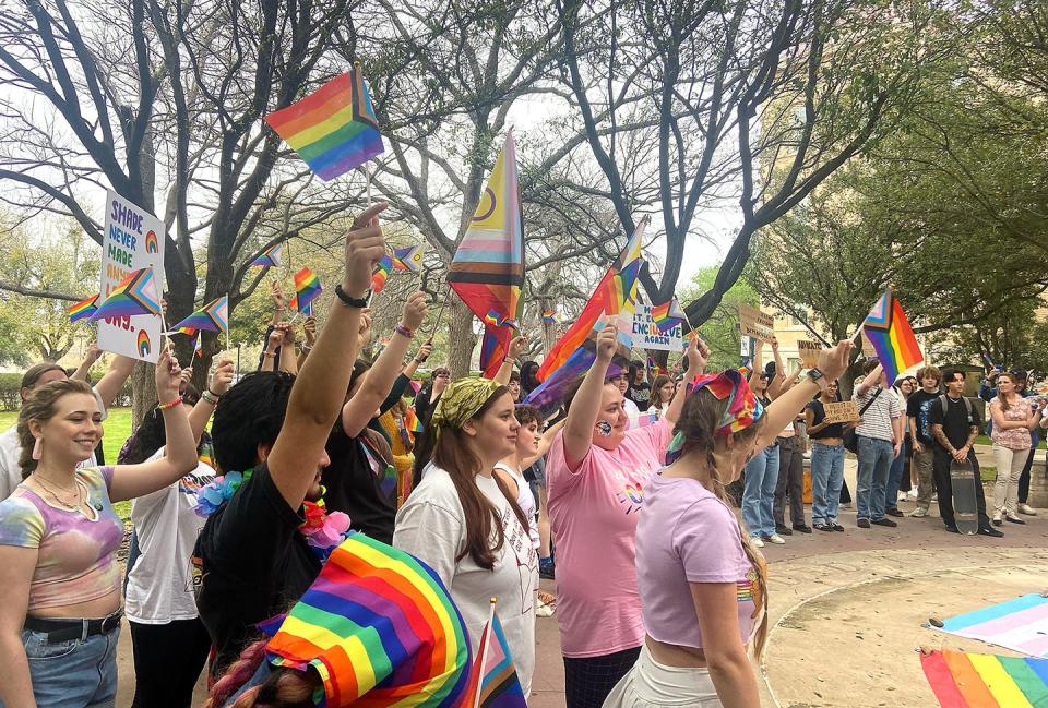 St. Edward's University students rally Tuesday on campus to protest the school removing a pride flag from the campus coffeehouse.