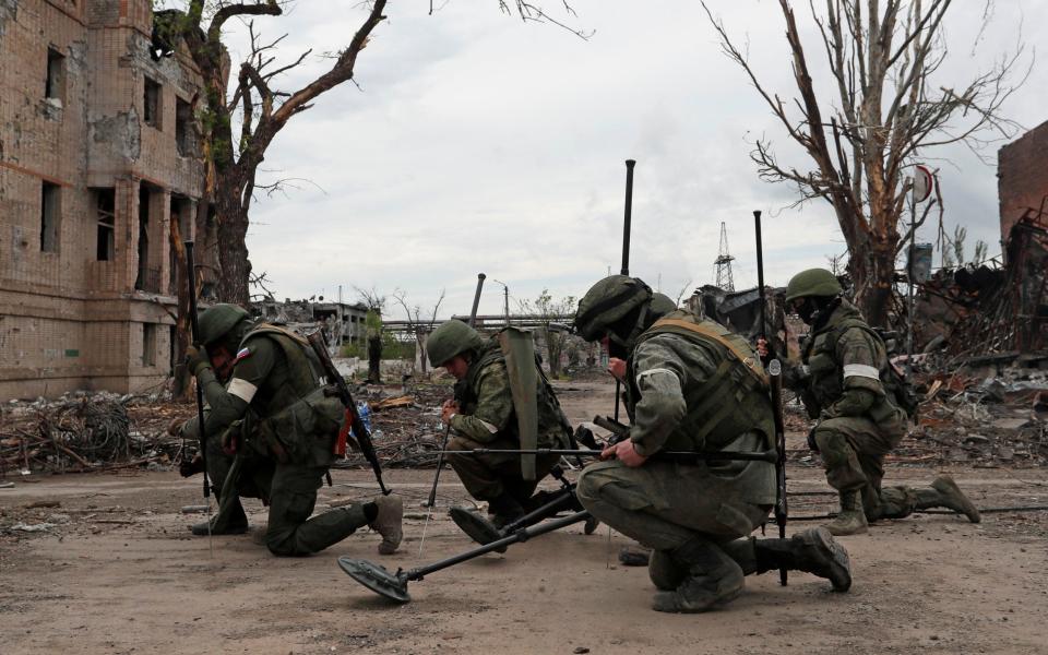 Russian service members demine the territory of Azovstal steel plant in Mariupol - REUTERS/Alexander Ermochenko