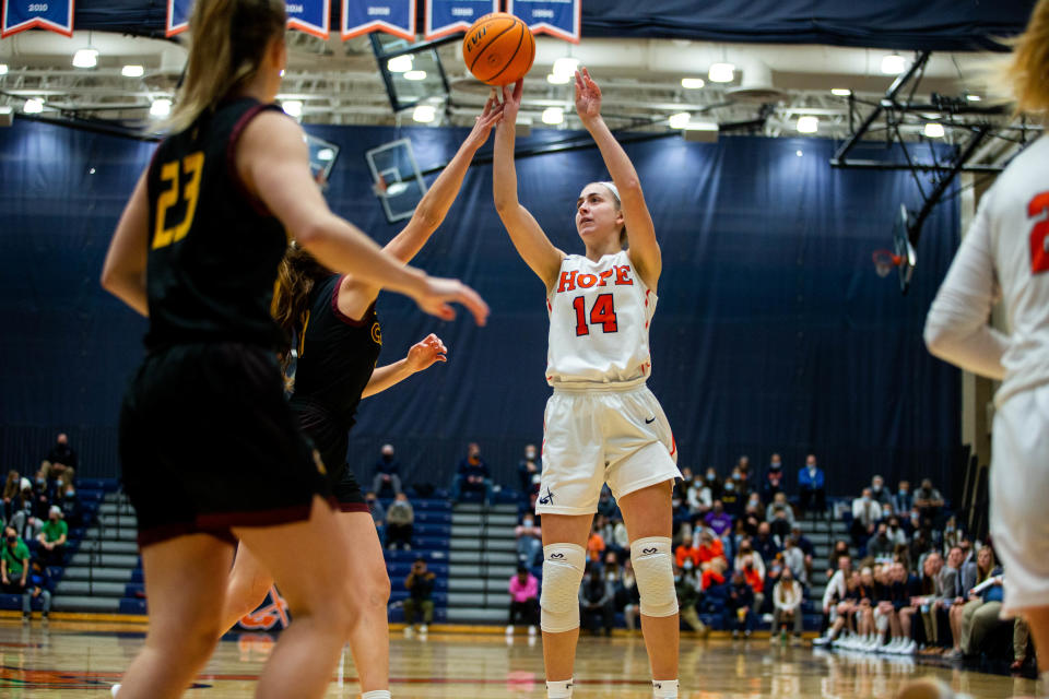 Hope's Kate Majerus takes a three during the first quarter against conference rival Calvin Wednesday, Dec. 1, 2021, at DeVos Fieldhouse. 