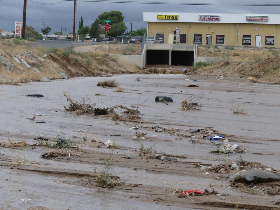 The tropical storm produced by Hurricane Hilary moved into the High Desert on Sunday. The storm flooded roads, washes, and backyards. It also made everyday life difficult for many.