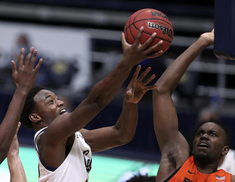 California guard Jalen Celestine, left, shoots against Oregon State forward Dearon Tucker, right, during the second half of an NCAA college basketball game in Berkeley, Calif., Thursday, Feb. 25, 2021. (AP Photo/Jed Jacobsohn)