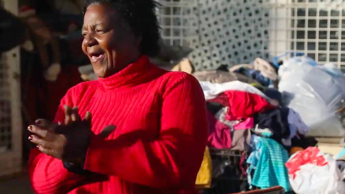 Sylvia Wiggins claps along as the Helping Hand Mission band practices in 2019.