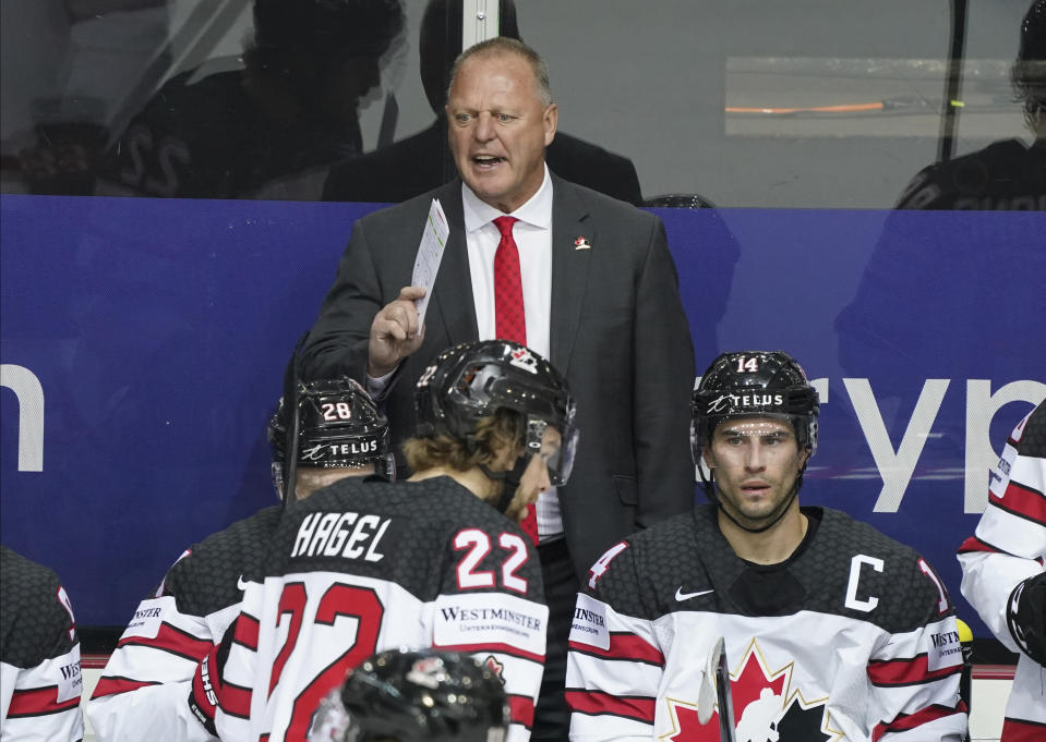 Canada's Head Coach Gerard Gallant speaking during the Ice Hockey World Championship quarterfinal match between Russia and Canada at the Olympic Sports Center in Riga, Latvia, Thursday, June 3, 2021. (AP Photo/Roman Koksarov)