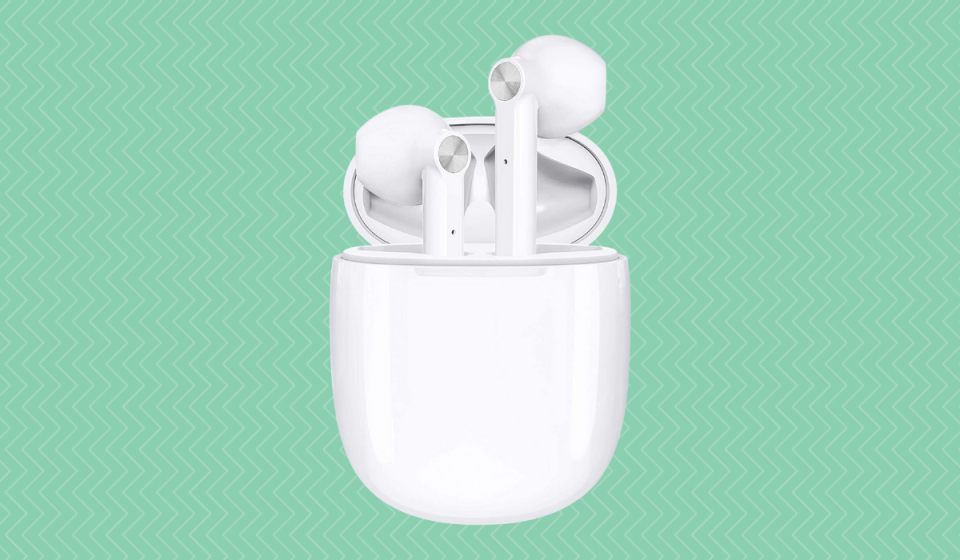 White wireless headphones coming out of a white charging case