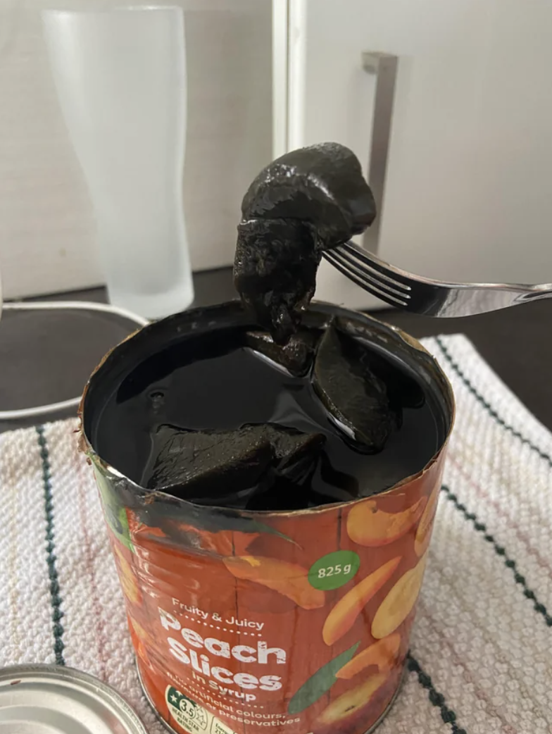 A can of black peaches