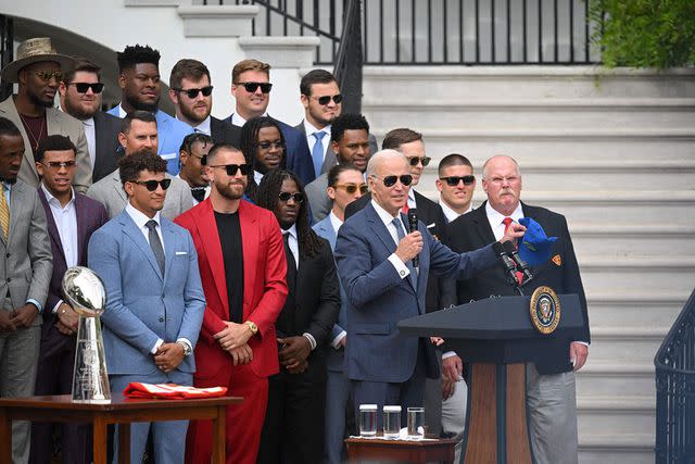 <p> MANDEL NGAN/AFP/Getty</p> Joe Biden and the Kansas City Chiefs at the White House in 2023.