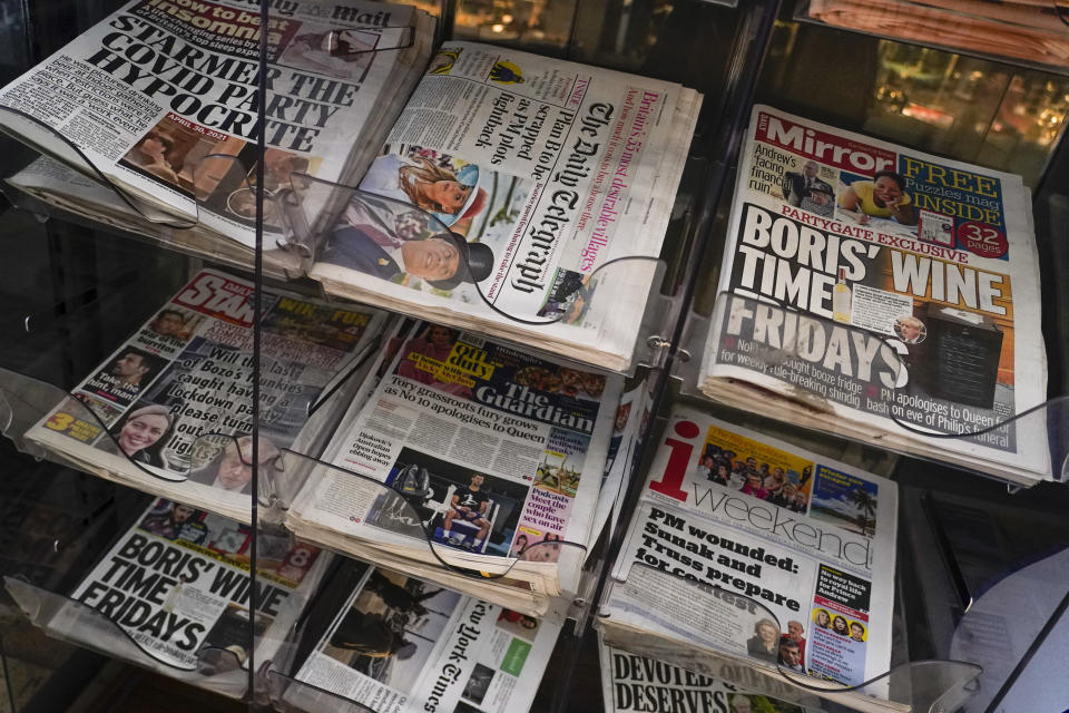 FILE - Front pages of British newspapers, some with Prime Minister Boris Johnson, are displayed outside a newsagent, in London, Jan. 15, 2022. Some Conservative lawmakers in Britain are talking about ousting Johnson, who has been tarnished by allegations that he and his staff held lockdown-breaching parties during the coronavirus pandemic. The party has a complex process for changing leaders that starts by lawmakers writing letters to demand a no-confidence vote. (AP Photo/Alberto Pezzali, File)