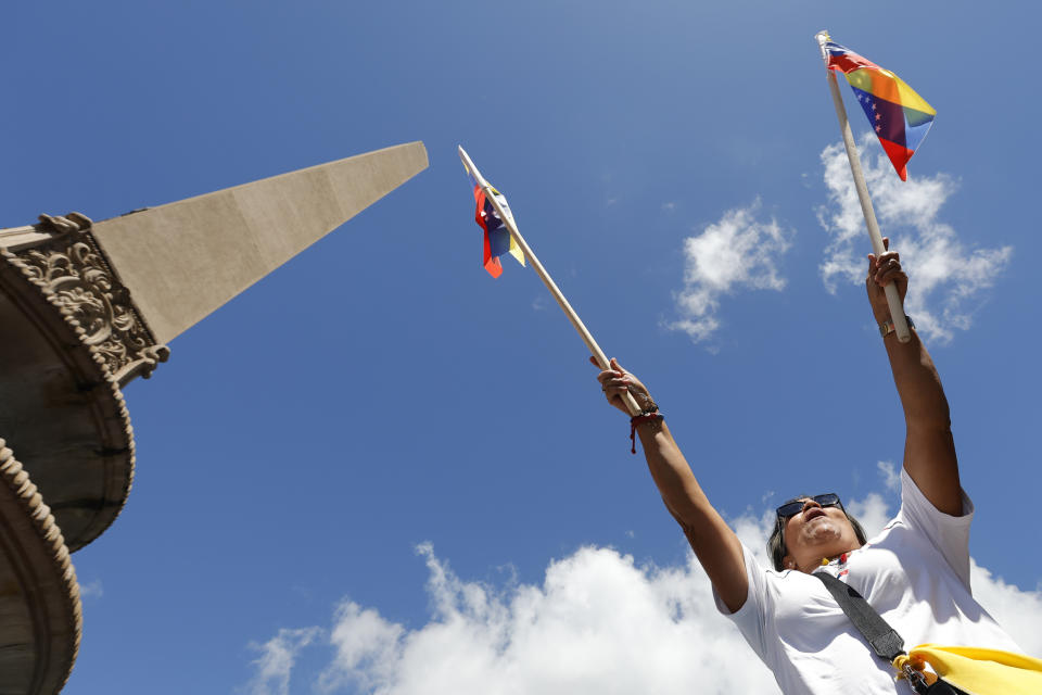 A supporter of opposition coalition presidential hopeful Maria Corina Machado attends her campaign event in Caracas, Venezuela, Tuesday, Jan. 23, 2024. An election date has not been set yet, when the opposition's one candidate, Machado, will run against current President Nicolas Maduro. (AP Photo/Jesus Vargas)