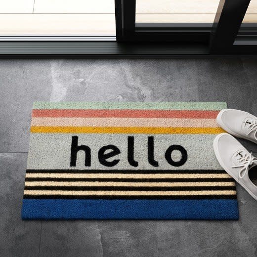 <a href="https://www.target.com/p/hello-doormat-1-6-x2-project-62-153/-/A-52089327#lnk=newtab" target="_blank">Shop it here</a>.&nbsp;