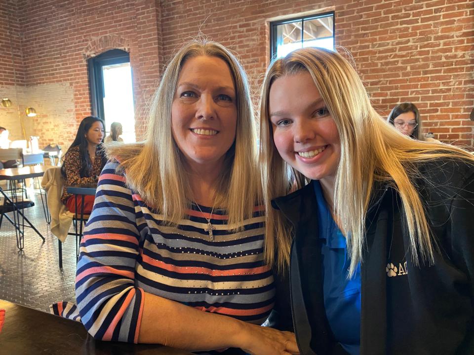 Lacey Fields, right, and her mother, Laura, share in the family cheerleader heritage and excitement about going back to Hawaii.