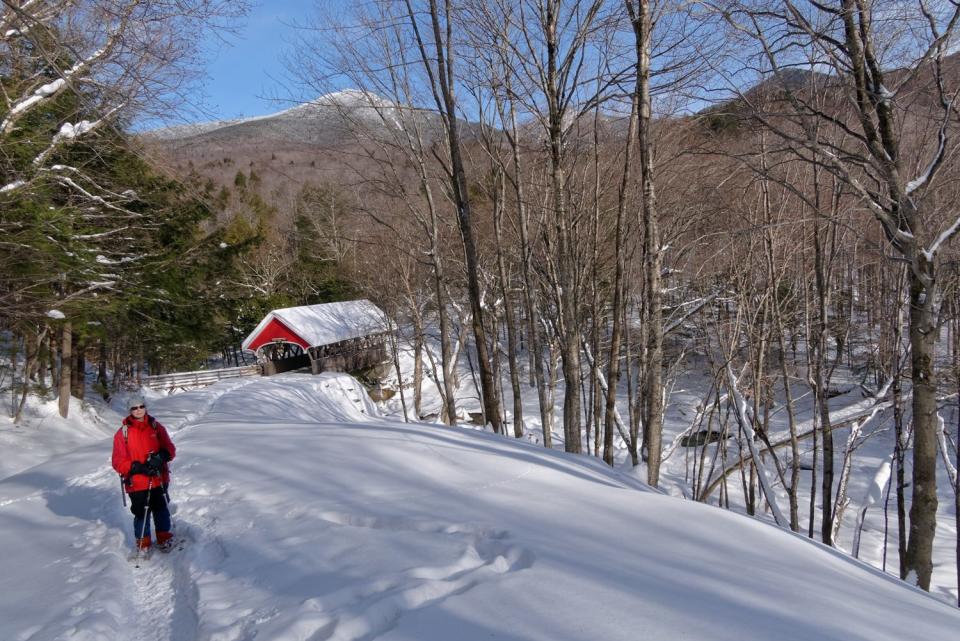 Cheryl Jensen, 76, of Bethlehem, New Hampshire, is photographed in 2018 snowshoeing in the White Mountains prior to her breast cancer diagnosis. Now, she says she no longer has the strength and stamina to do many of the outdoor activities she loves.