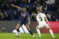 PSG's Marie-Antoinette Katoto controls the ball next to Hacken's Aivi Luik during the women's Champions League quarterfinals, second leg, soccer match between Paris Saint-Germain and BK Hacken at Parc des Princes, in Paris, Thursday, March 28, 2024. (AP Photo/Thibault Camus)