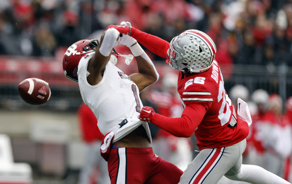 Ohio State corner back Cameron Brown, right, breaks up a pass intended for Indiana wide receiver Donaven McCulley during the first half of an NCAA college football game Saturday, Nov. 12, 2022 in Columbus, Ohio. (AP Photo/Paul Vernon)