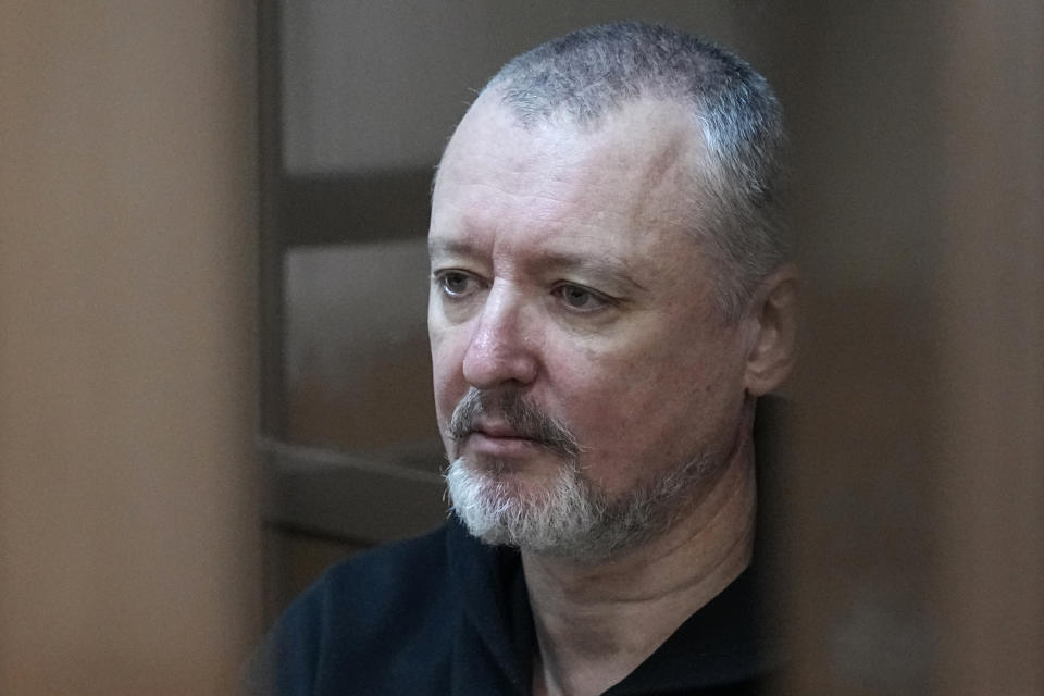 FILE - Igor Girkin also know as Igor Strelkov, the former military chief for Russia-backed separatists in eastern Ukraine, sits in a glass cage in a courtroom at the Moscow's City Court in Moscow, Russia, Tuesday, Oct. 17, 2023. On Thursday, Dec. 14, the trial of the hard-line nationalist who publicly criticized the Kremlin and its conduct in Ukraine opened in a Moscow court. (AP Photo/Alexander Zemlianichenko, File)