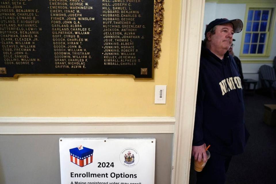 A voter waits for the polls to open in Kennebunk, Maine, Tuesday, March 5, 2024.  Super Tuesday elections are being held in 16 states and one territory. Hundreds of delegates are at stake, the biggest haul for either party on a single day.  (AP Photo/Michael Dwyer)