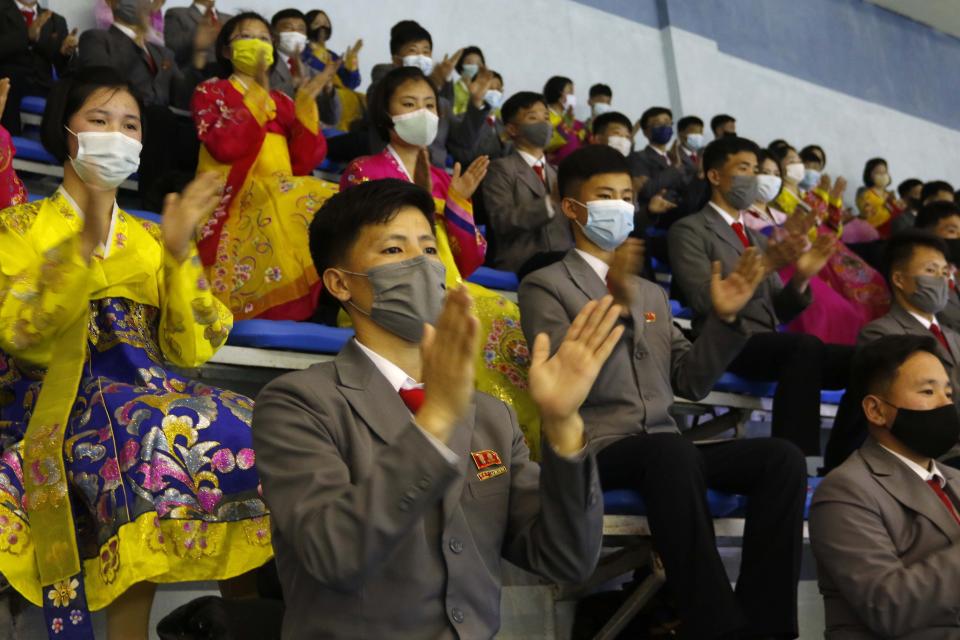 People clap hands as they watch the performance of synchronized swimming marking the Day of Shining Star on the occasion of the 80th birth anniversary of former North Korean leader Kim Jong Il at a swimming gymnasium in the Chongchun Street in Pyongyang,, on Sunday, Feb. 13, 2022. (AP Photo/Jon Chol Jin)