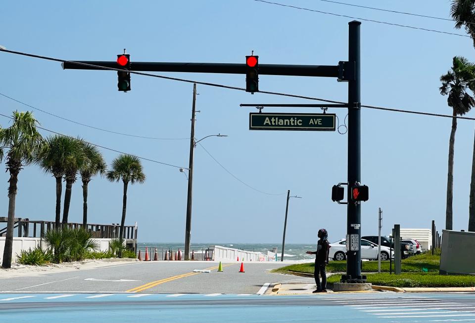 This is a view of the east end of Silver Beach Avenue in Daytona Beach, looking towards the ocean from A1A, on Monday, Oct. 2, 2023. The vacant lot on the right of the public beach access is where developers are proposing a 25-story luxury condo-hotel.