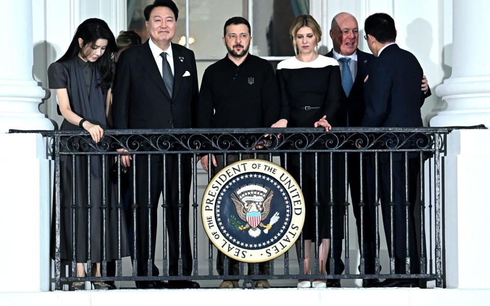 Volodymyr and Olena Zelensky at the South Portico of the White House alongside Yoon Suk Yeol, the South Korean president, and his wife