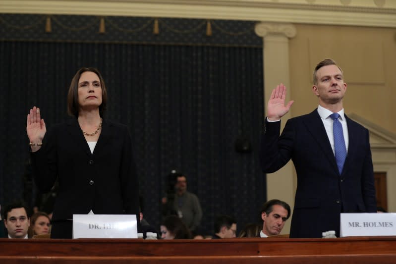 Fiona Hill takes the oath with David Holmes before testifying in front of the House Intelligence Committee hearing as part of Trump impeachment inquiry on Capitol Hill in Washington