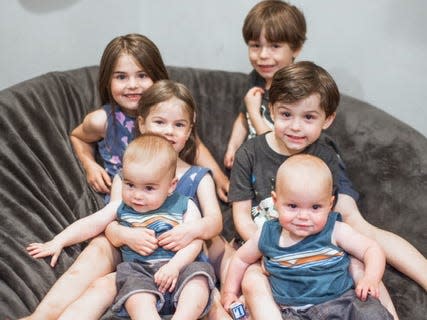 Three sets of twins posing for a photo